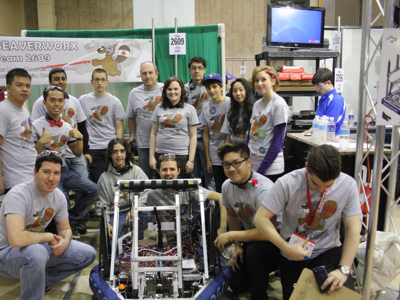 Team 2609 Beaverworx with their robot in the pits